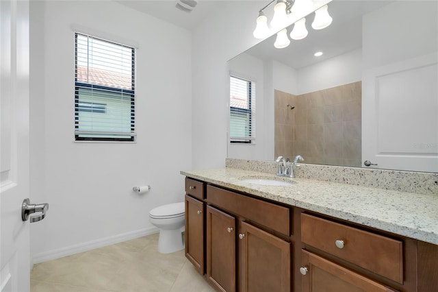 bathroom with vanity, a shower, tile patterned floors, and toilet