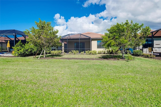 view of yard with a lanai