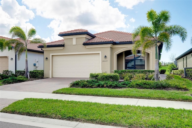 mediterranean / spanish-style house featuring a garage