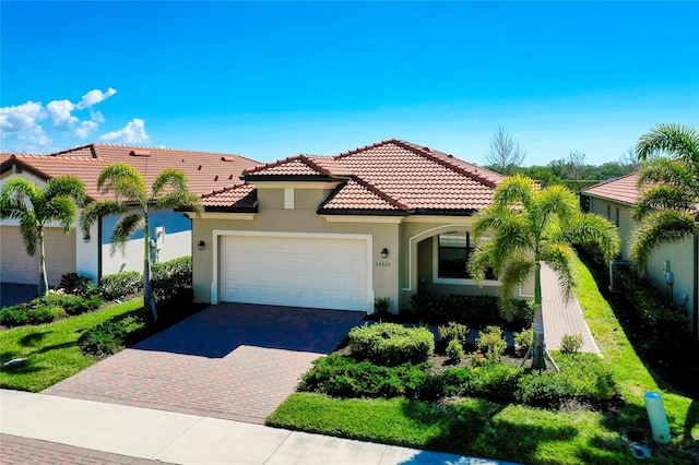 mediterranean / spanish-style home featuring a garage