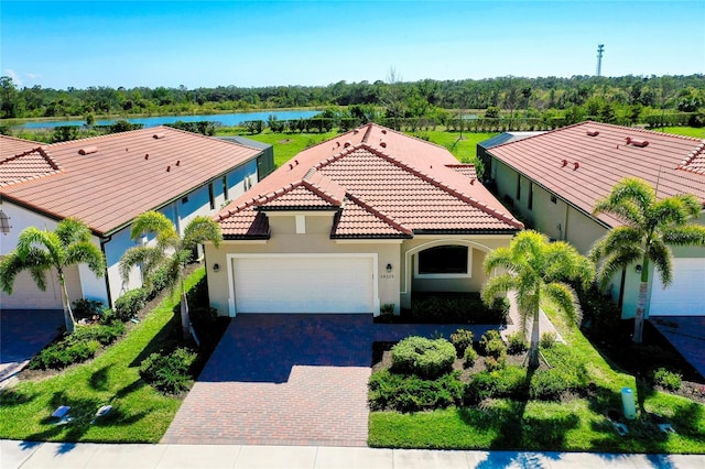 view of front facade with a water view and a garage