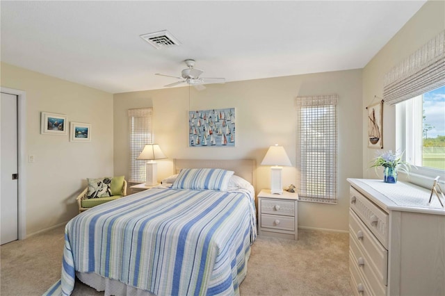 407 Rubens Dr, Nokomis, FL 34275 - bedroom featuring light colored carpet, baseboards, and a ceiling fan