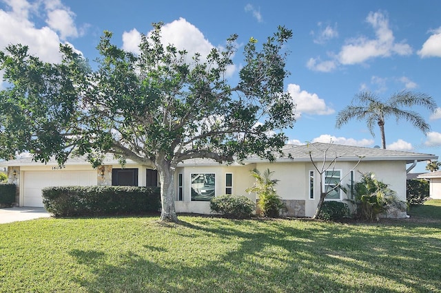 ranch-style home featuring a garage and a front yard