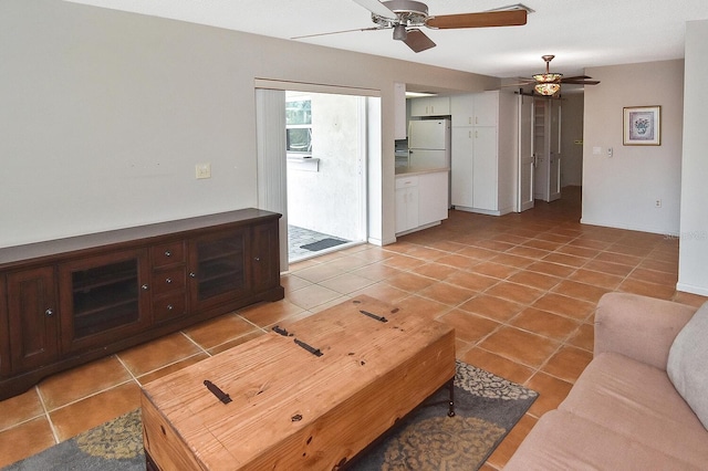 living room with a ceiling fan and light tile patterned flooring