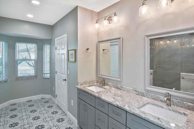 bathroom featuring walk in shower, tile patterned floors, and vanity