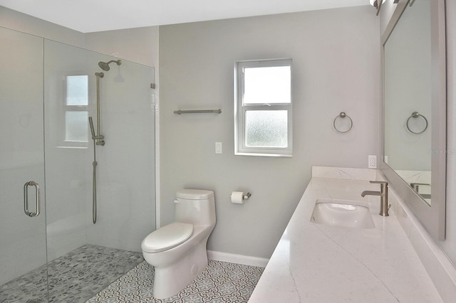 bathroom featuring an enclosed shower, vanity, tile patterned flooring, and toilet