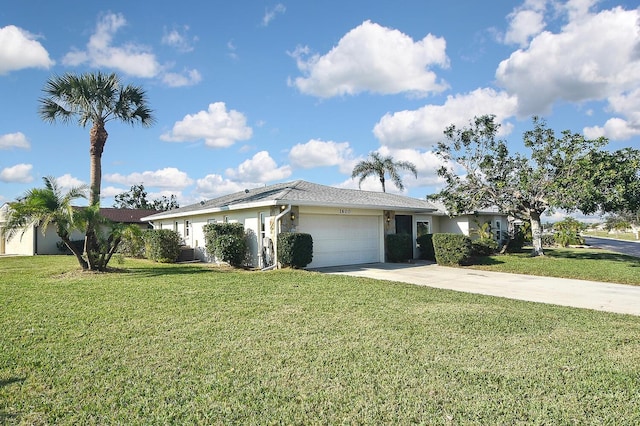 ranch-style house with a garage and a front lawn