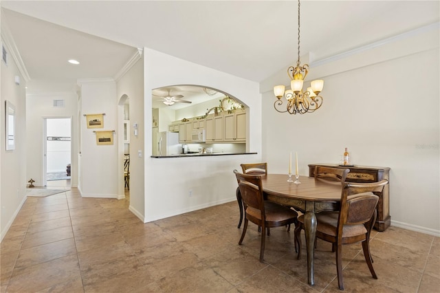 dining room with ornamental molding and ceiling fan with notable chandelier