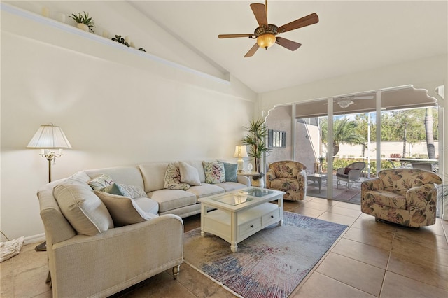 tiled living room with ceiling fan and high vaulted ceiling