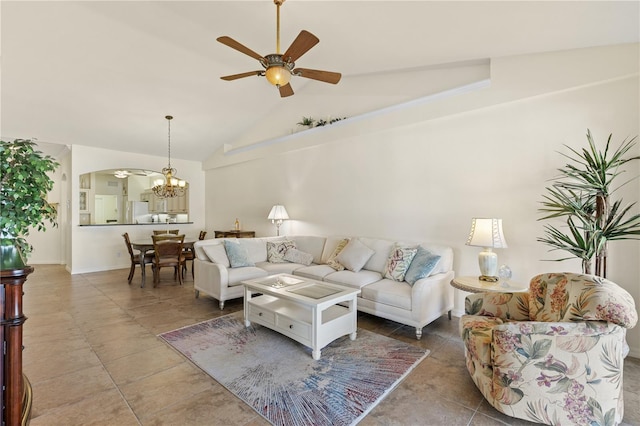 tiled living room featuring lofted ceiling and ceiling fan with notable chandelier