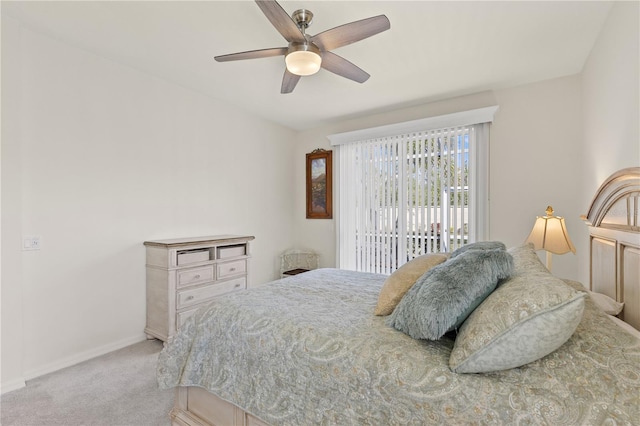 bedroom featuring access to outside, light colored carpet, ceiling fan, and baseboards