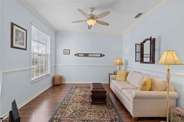 living room with baseboards, visible vents, dark wood finished floors, and crown molding