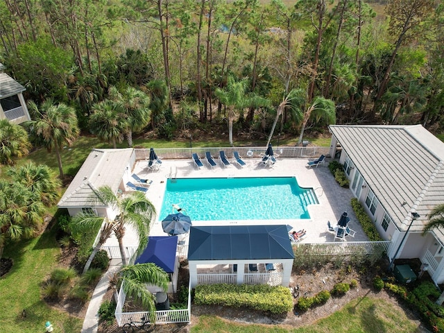 view of swimming pool with a lanai and a patio area