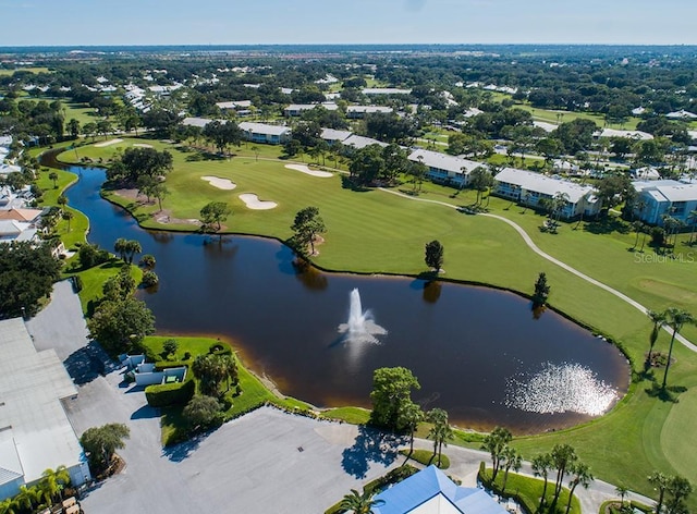 aerial view with a water view and golf course view