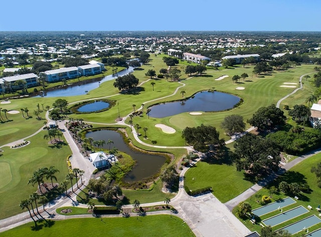 aerial view featuring a water view and golf course view