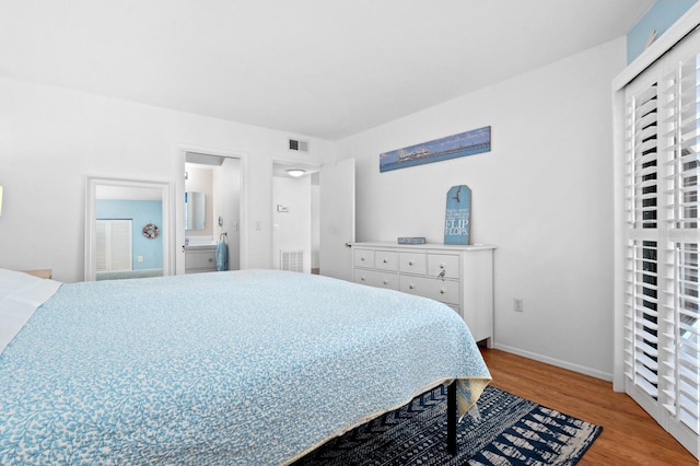 bedroom with wood-type flooring