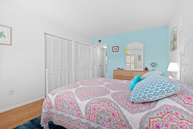 bedroom with hardwood / wood-style flooring