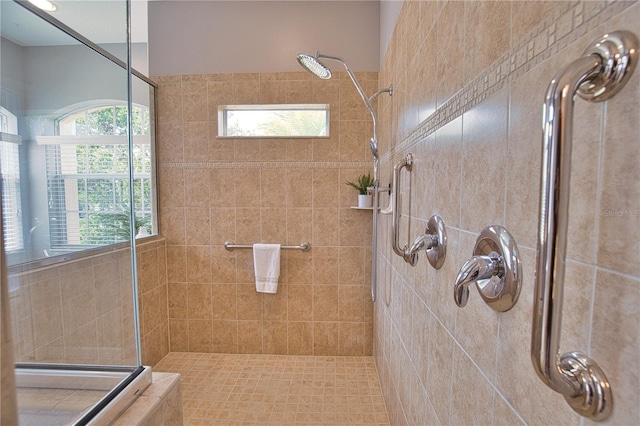 bathroom with tiled shower