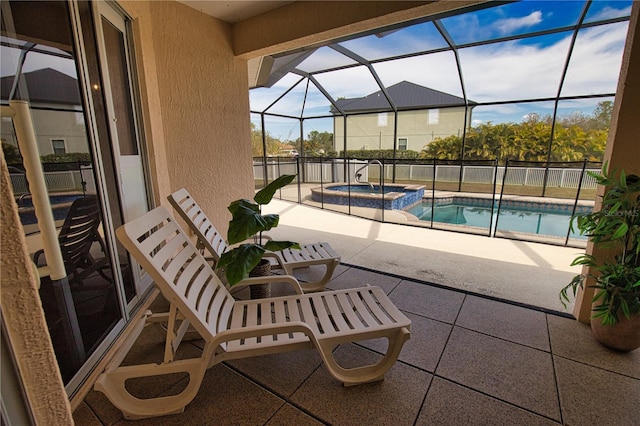 view of pool with a lanai, a patio area, and an in ground hot tub