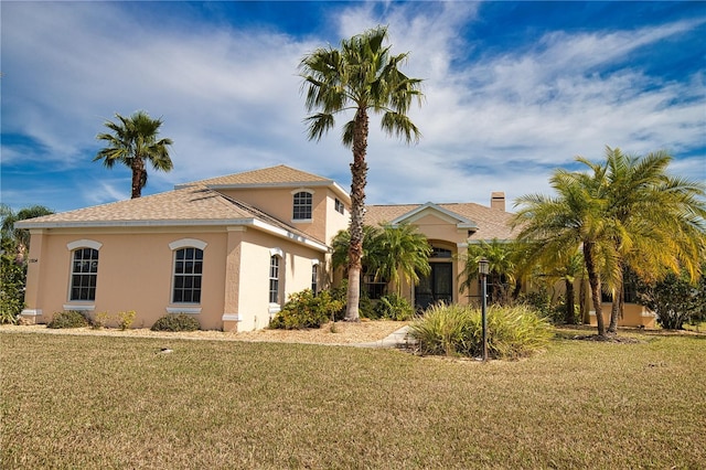 view of front of house with a front lawn