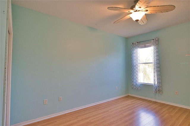 unfurnished room with ceiling fan and light hardwood / wood-style flooring