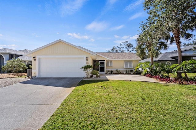 ranch-style house featuring a front yard, driveway, an attached garage, and central air condition unit