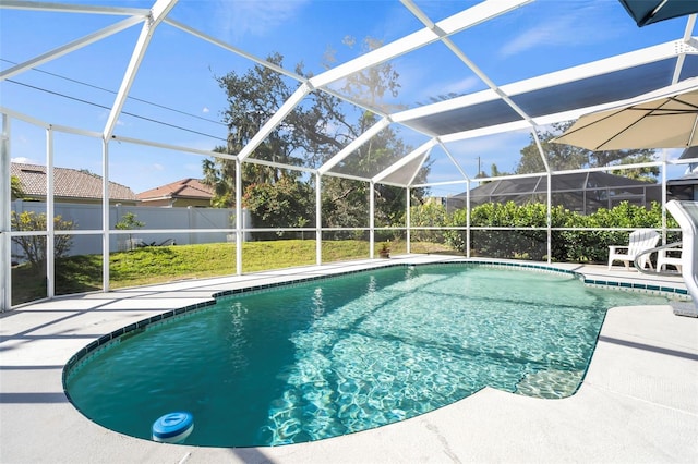 view of swimming pool with glass enclosure, fence, a fenced in pool, and a patio