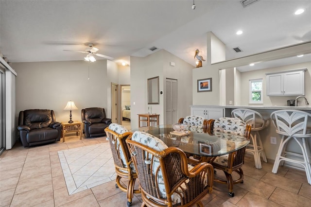 dining area with light tile patterned floors, visible vents, a ceiling fan, lofted ceiling, and recessed lighting