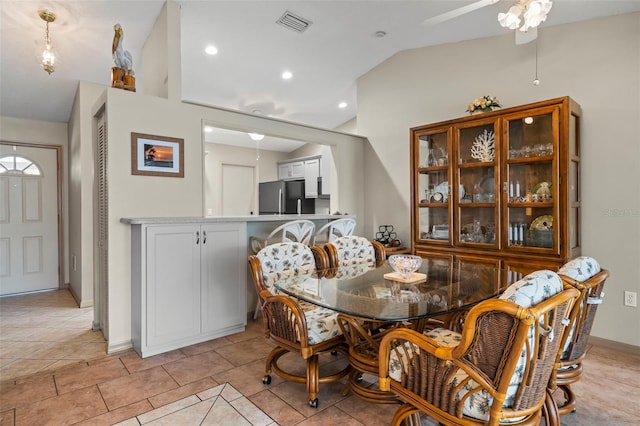 dining room with vaulted ceiling, light tile patterned floors, visible vents, and recessed lighting