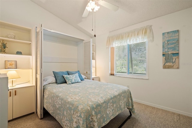 carpeted bedroom featuring a ceiling fan, vaulted ceiling, and baseboards