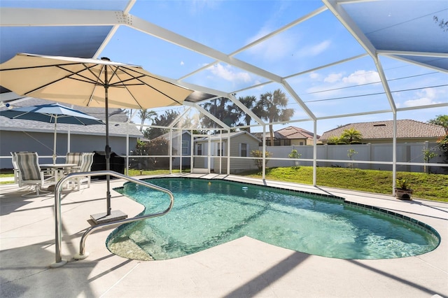 view of pool featuring a lanai, fence, a fenced in pool, and a patio