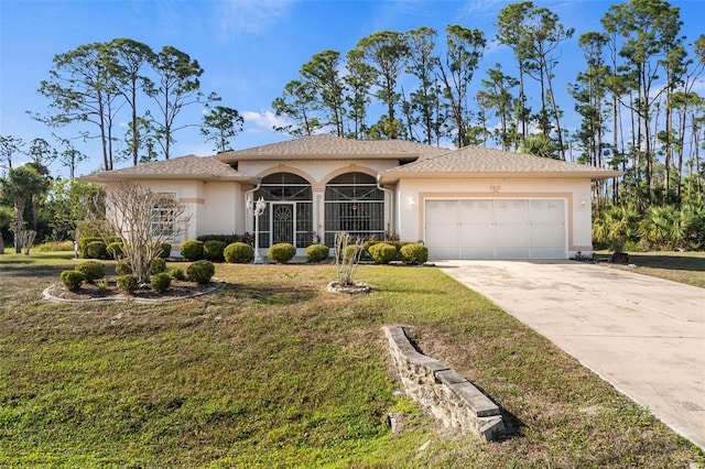 view of front of property featuring a garage and a front yard