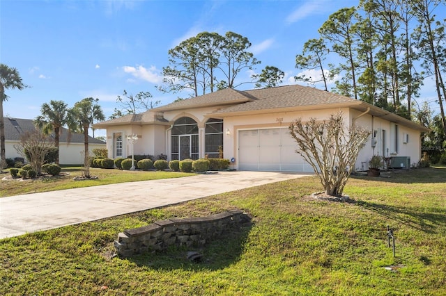 single story home featuring a garage, a front yard, and central air condition unit