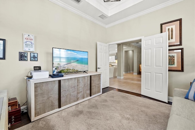 interior space featuring baseboards, wood finished floors, and crown molding