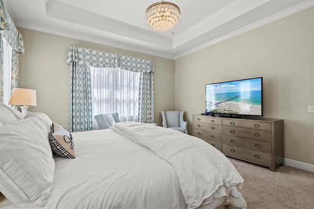 bedroom with carpet floors, a tray ceiling, baseboards, and an inviting chandelier