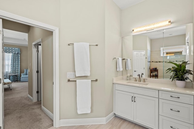 bathroom featuring vanity and baseboards