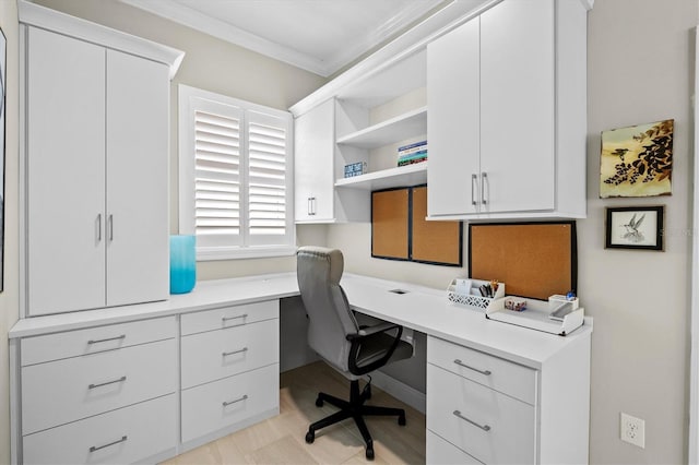 office featuring crown molding and built in study area