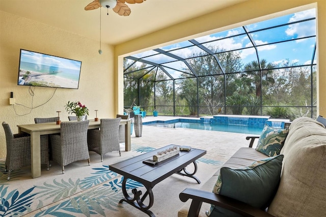 pool with outdoor dining area, a patio area, ceiling fan, and an outdoor hangout area