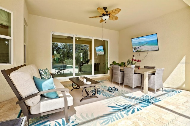 view of patio featuring an outdoor hangout area, ceiling fan, and outdoor dining area