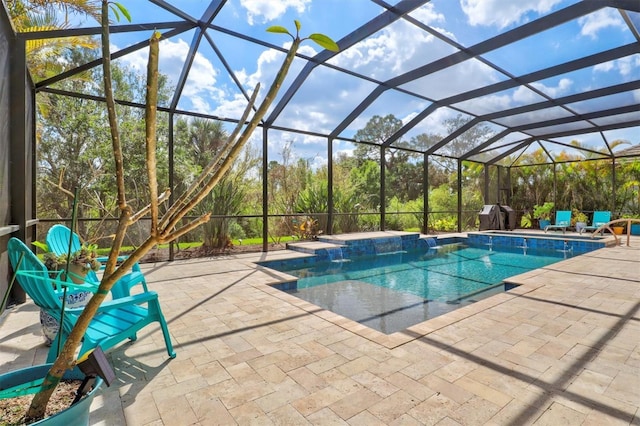 pool with a patio area and glass enclosure