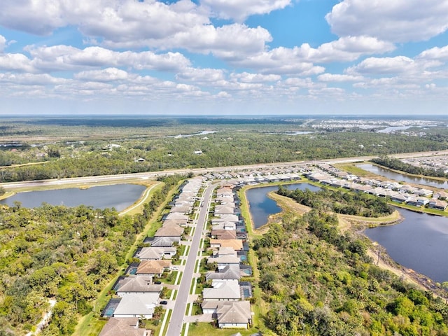 aerial view with a water view and a residential view