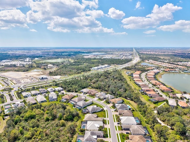 birds eye view of property featuring a water view and a residential view