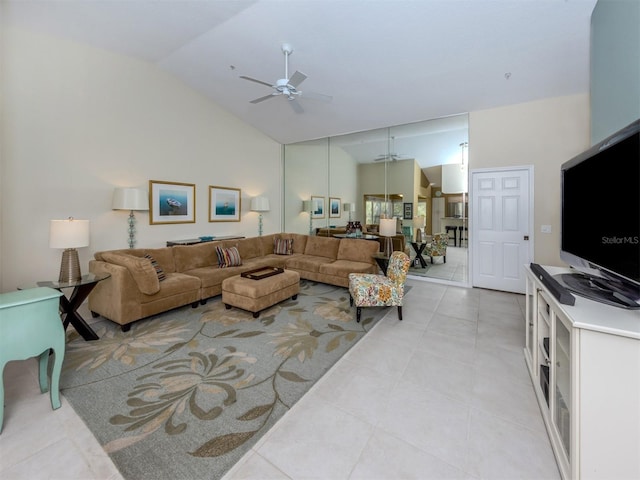 living room with light tile patterned floors, high vaulted ceiling, and ceiling fan