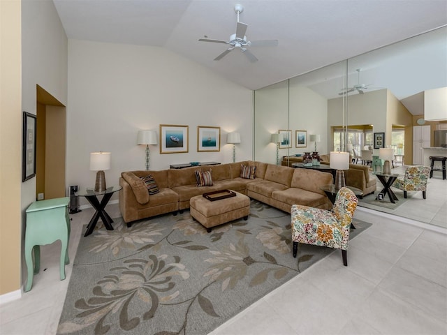 living room with high vaulted ceiling, light tile patterned floors, and ceiling fan