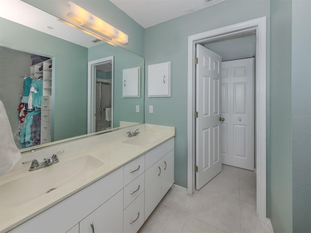 bathroom with vanity and tile patterned floors