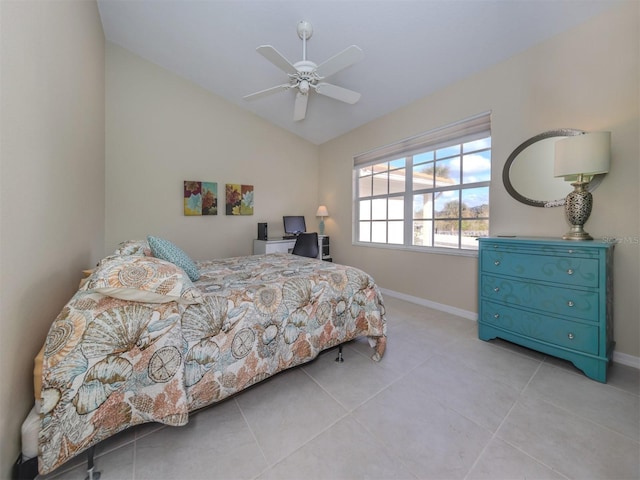 tiled bedroom featuring ceiling fan and vaulted ceiling