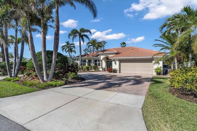 mediterranean / spanish house with a garage