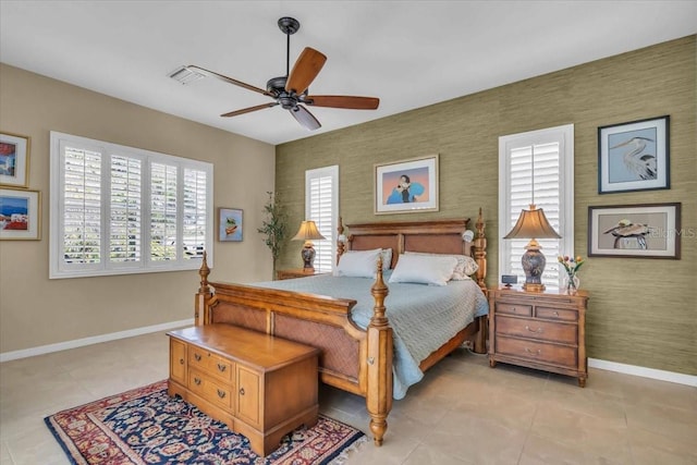 bedroom with ceiling fan and light tile patterned floors