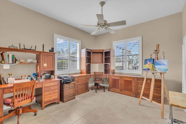 tiled office featuring ceiling fan