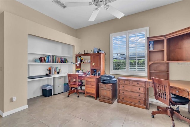 office space with light tile patterned floors and ceiling fan